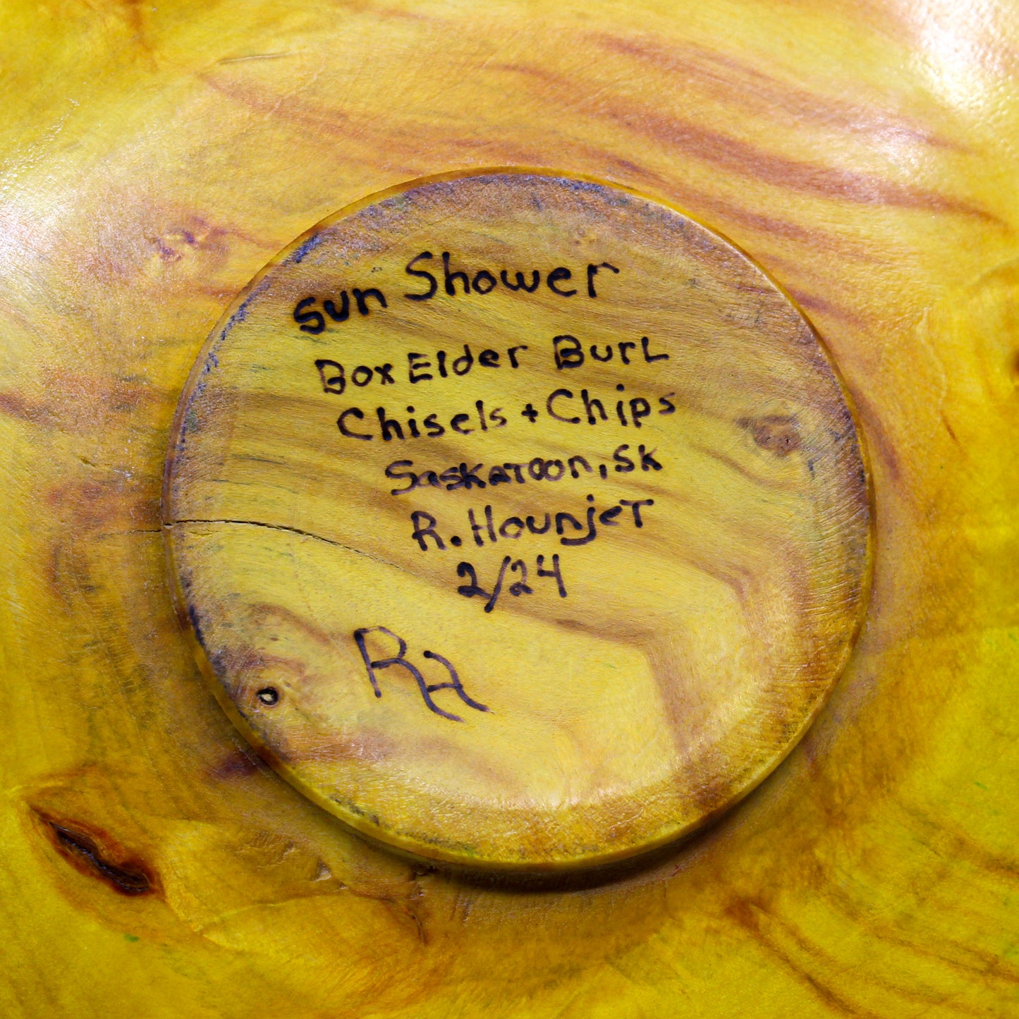 Artist signed bottom of plate: Sun Shower. Box Elder Burl. Chisels + Chips. Saskatoon, SK. R. Hounjet. 2/24.