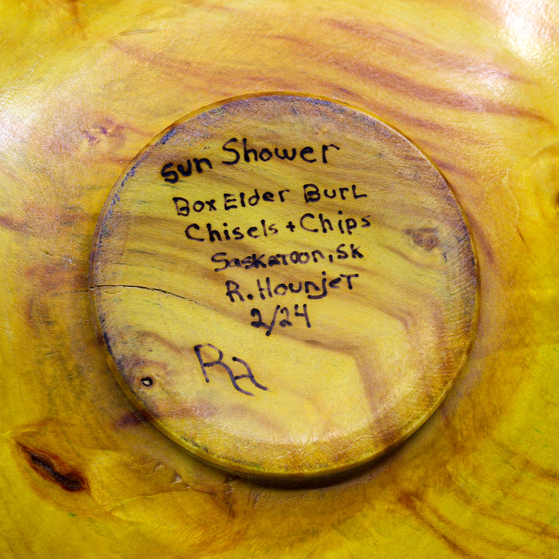 Artist signed bottom of plate: Sun Shower. Box Elder Burl. Chisels + Chips. Saskatoon, SK. R. Hounjet. 2/24.