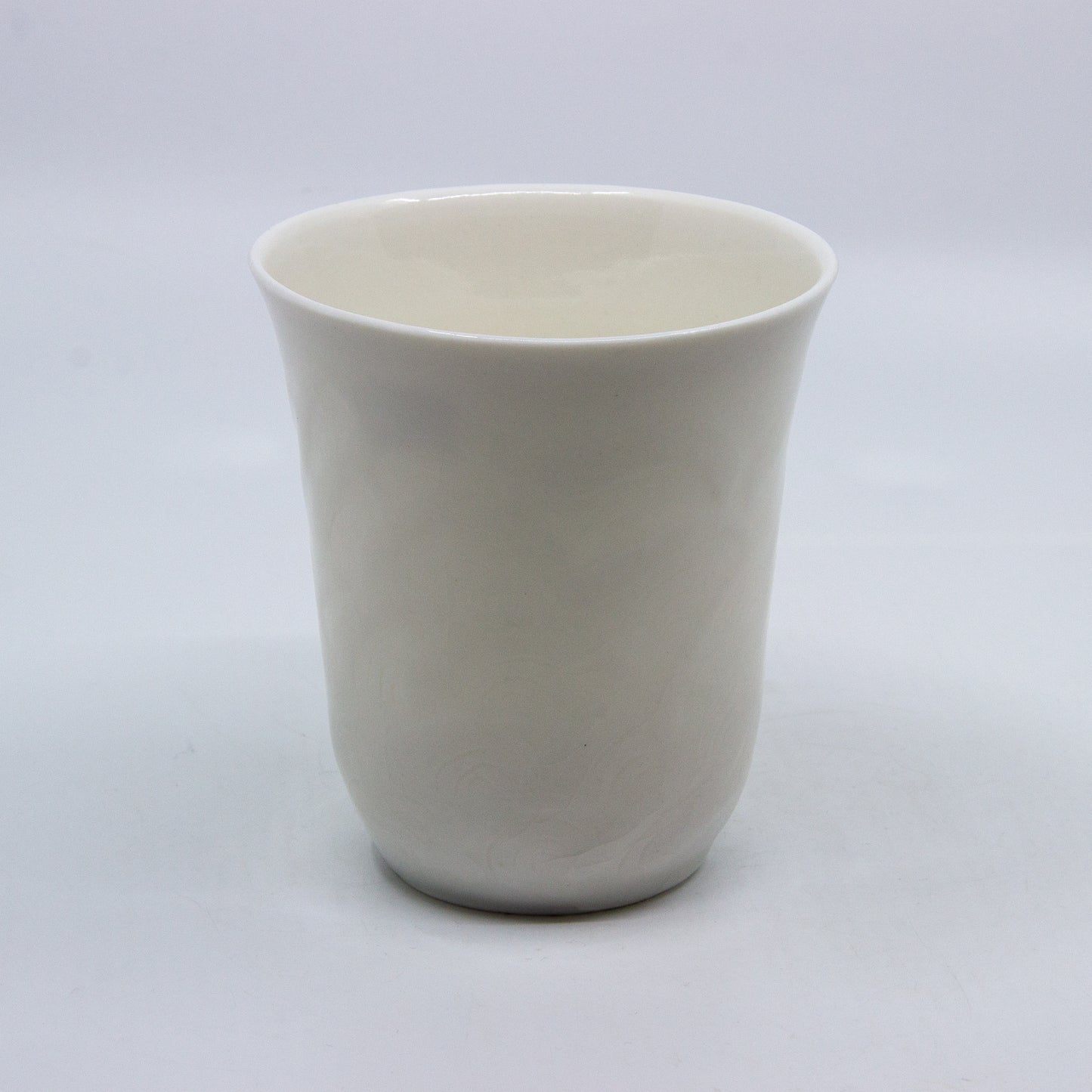 white porcelain candle holder