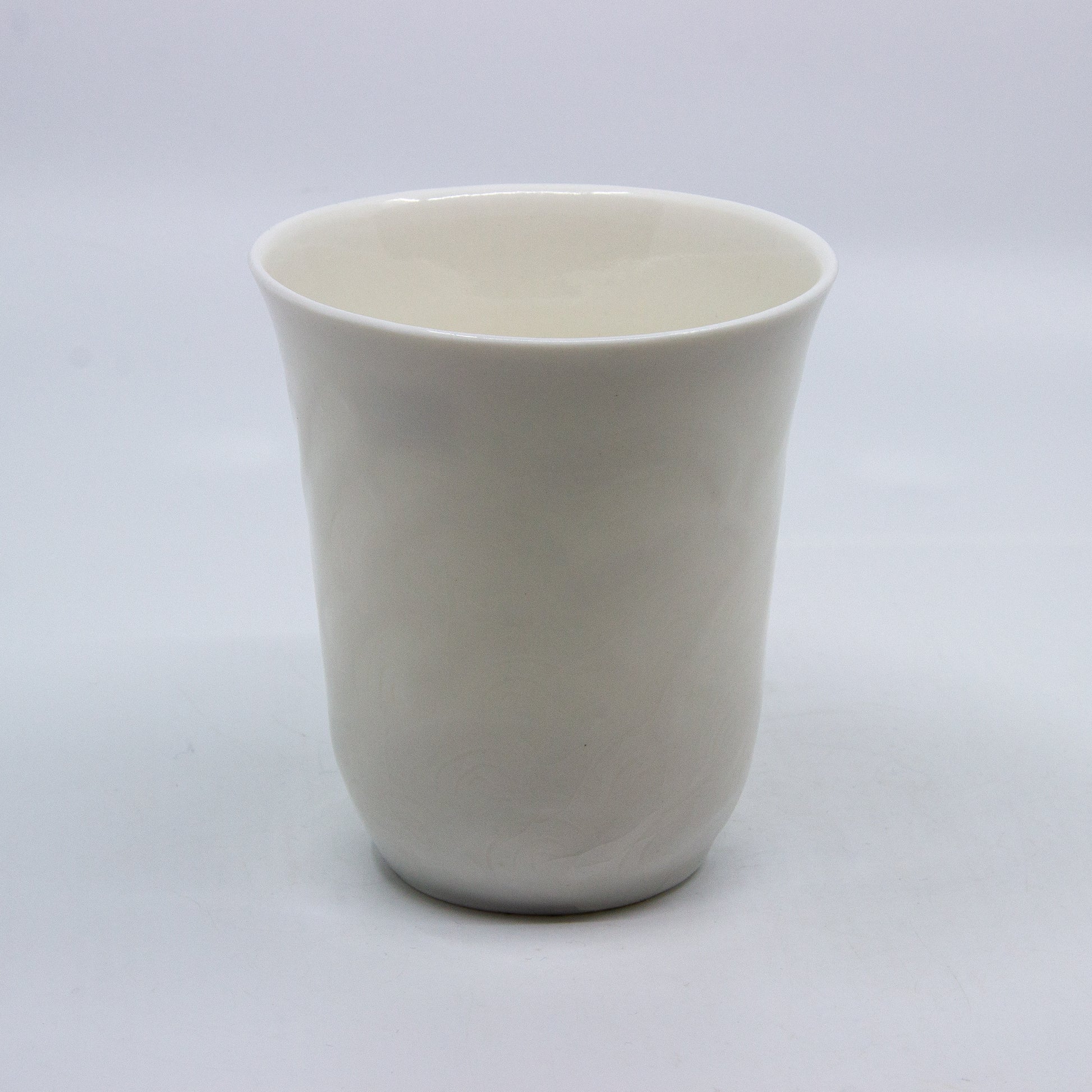 white porcelain candle holder