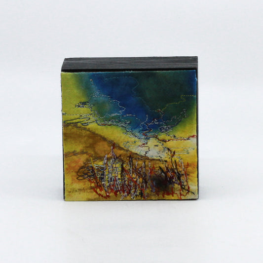 Mini thread painting of dark blue sky and yellow hills