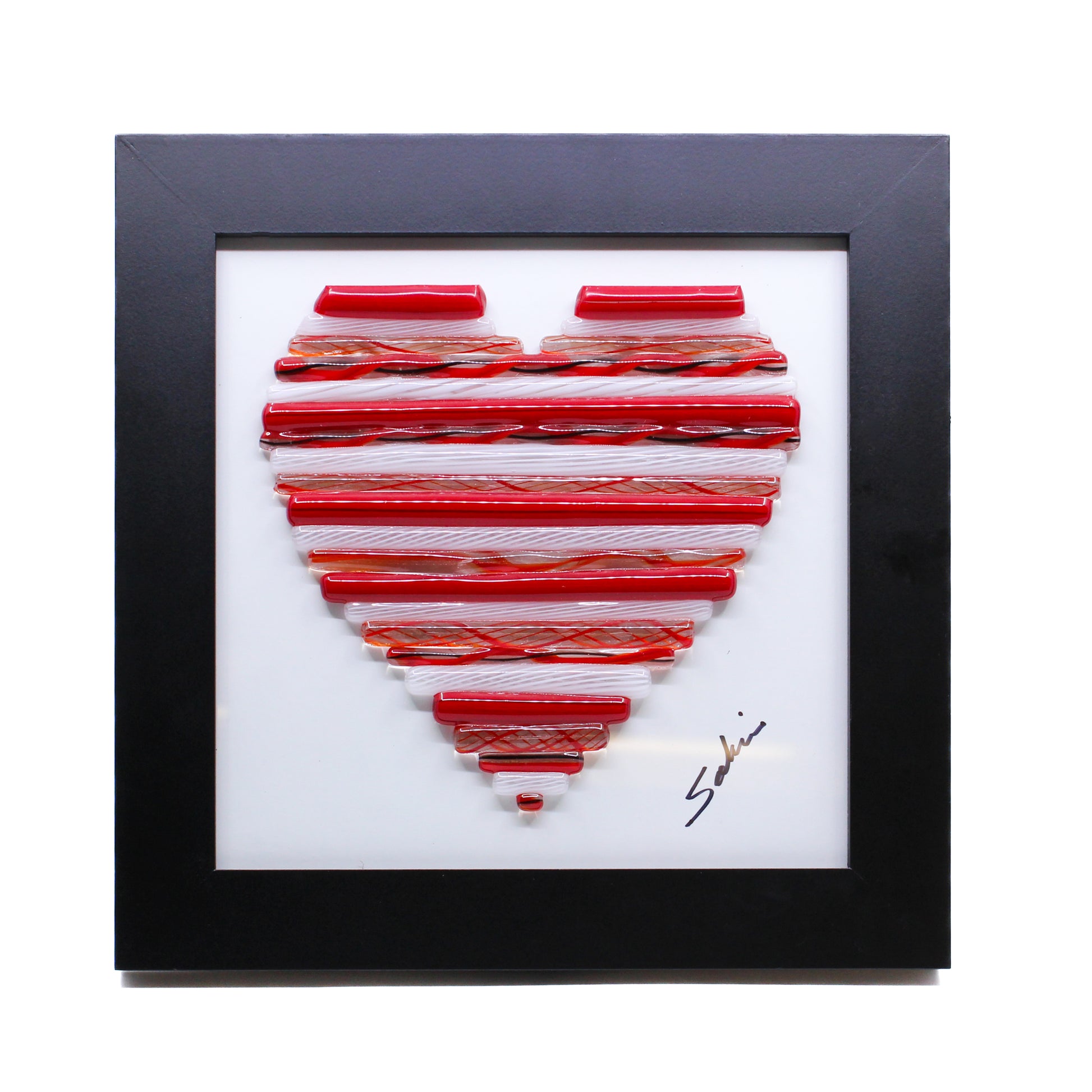 Red and white glass canes in shape of heart