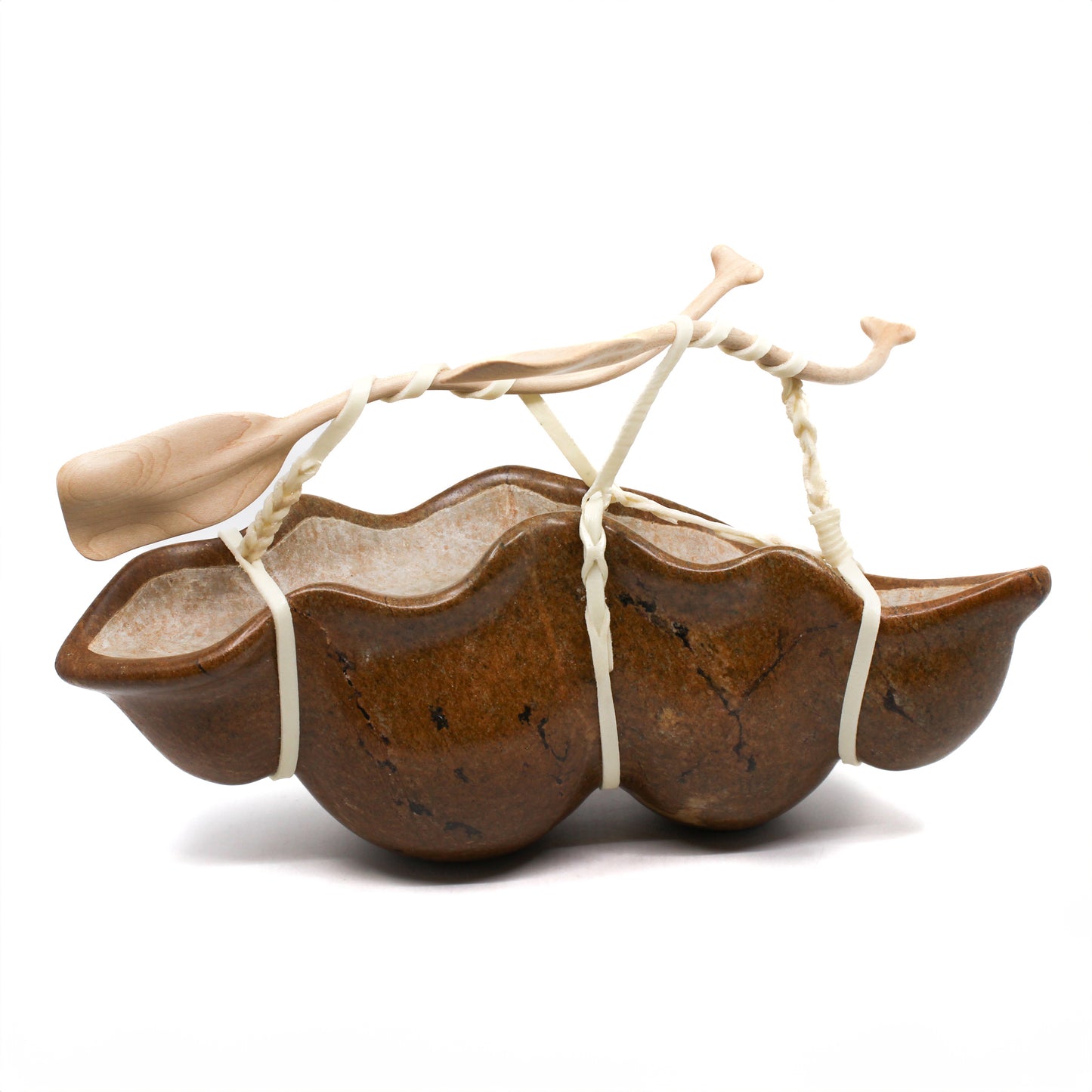 Sculpture of a canoe with paddles