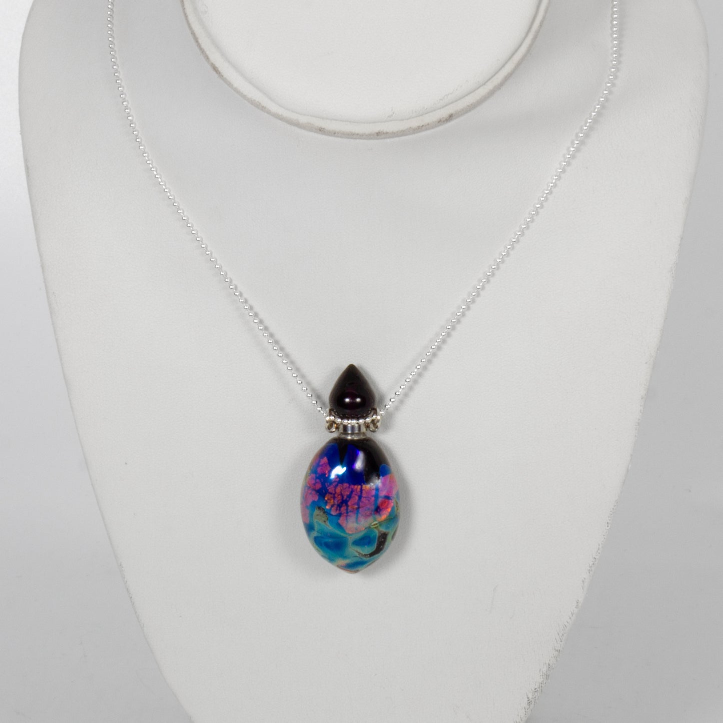 Necklace with a colorful pendant on a white background