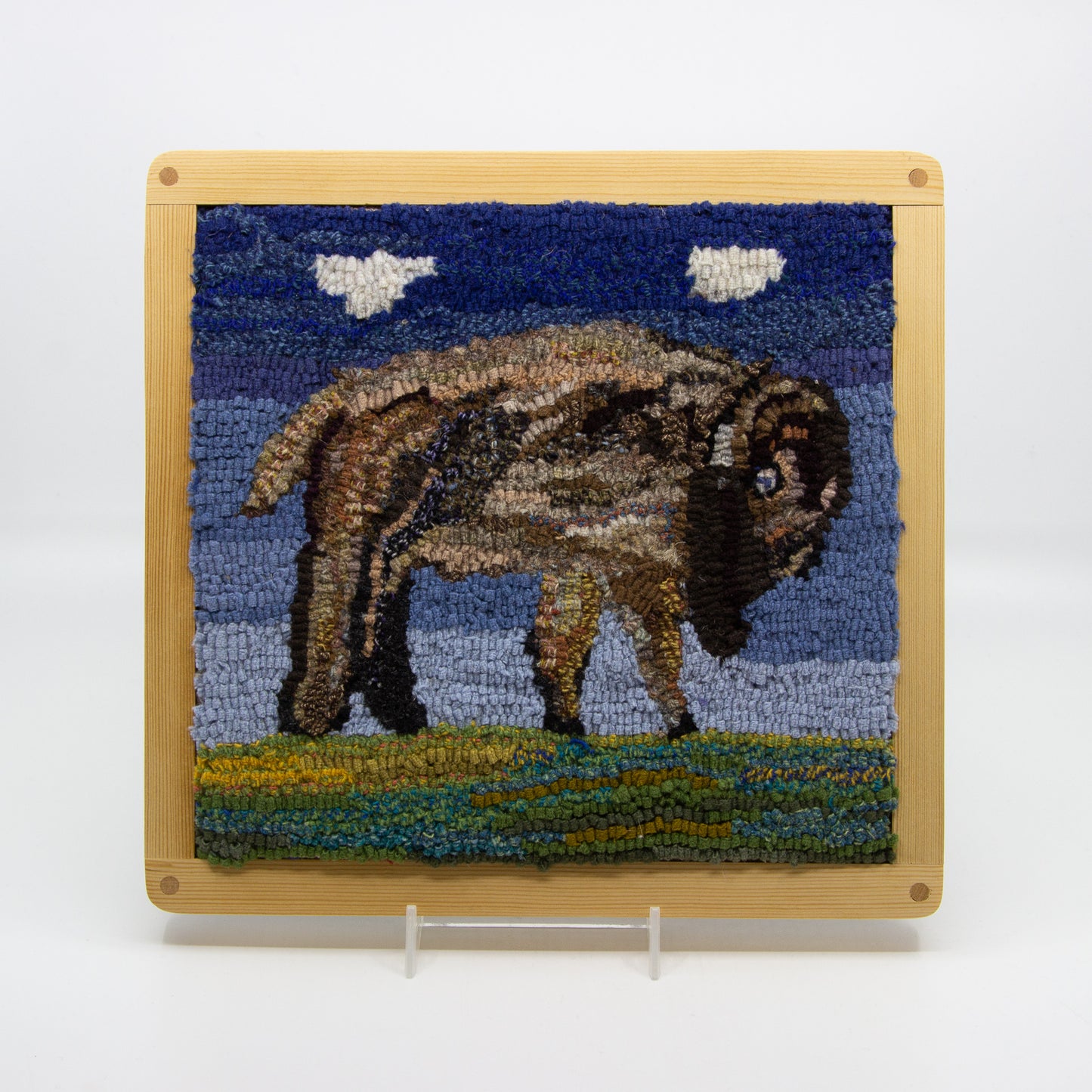 Rug hooking of a bison