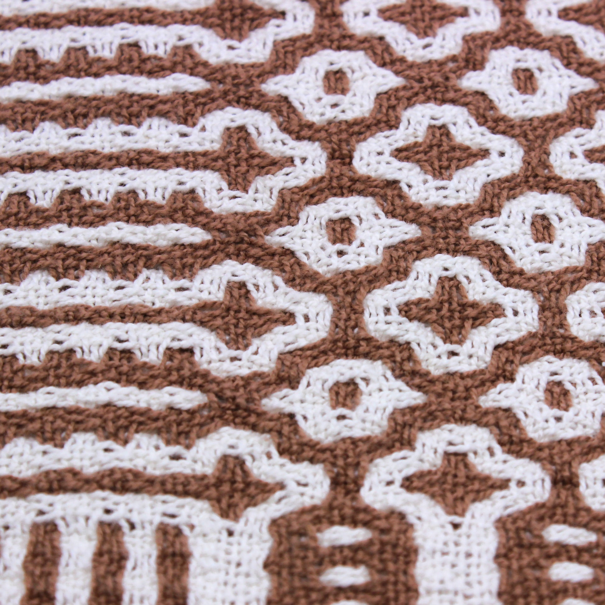 brown and white double weave table runner
