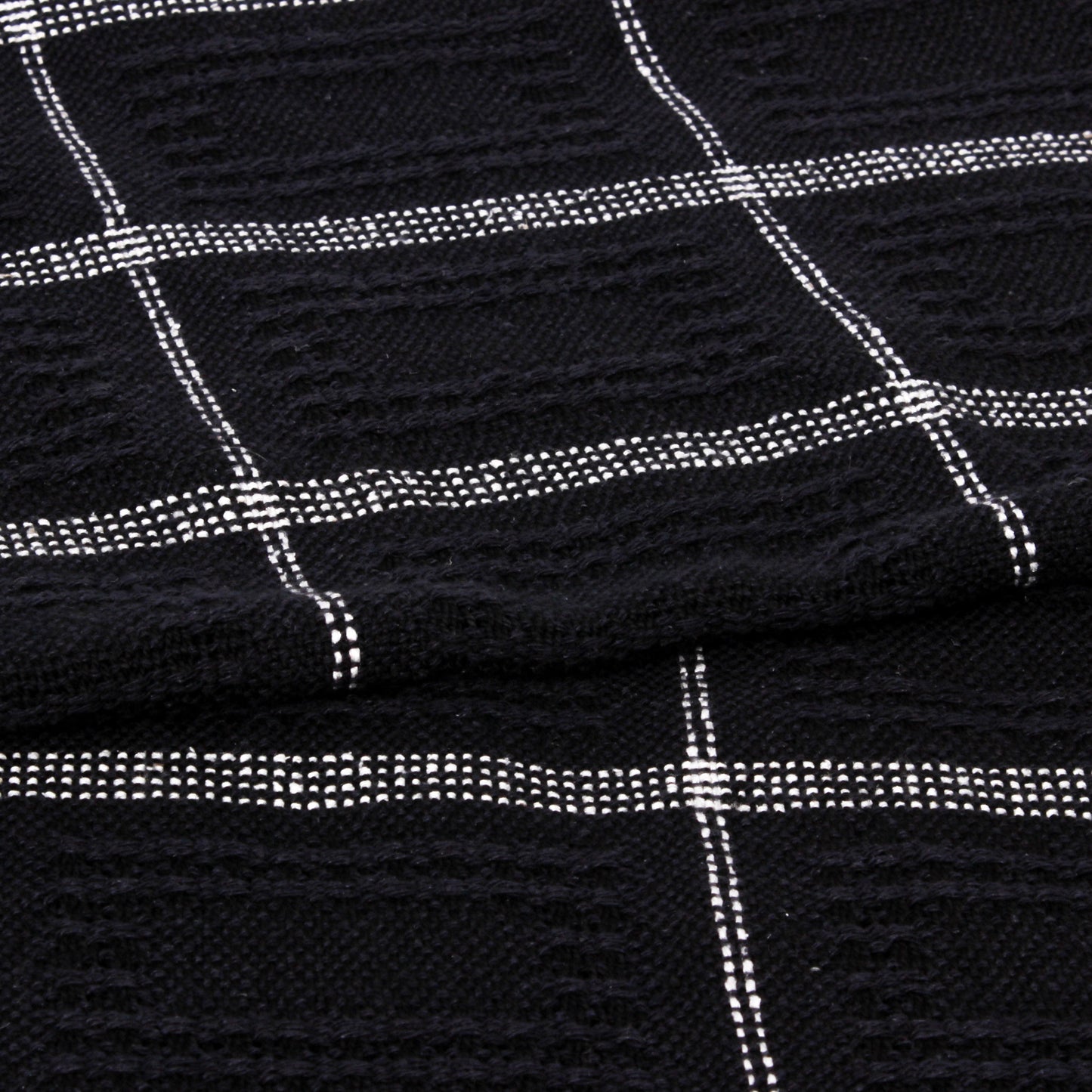 Black fabric with white grid pattern