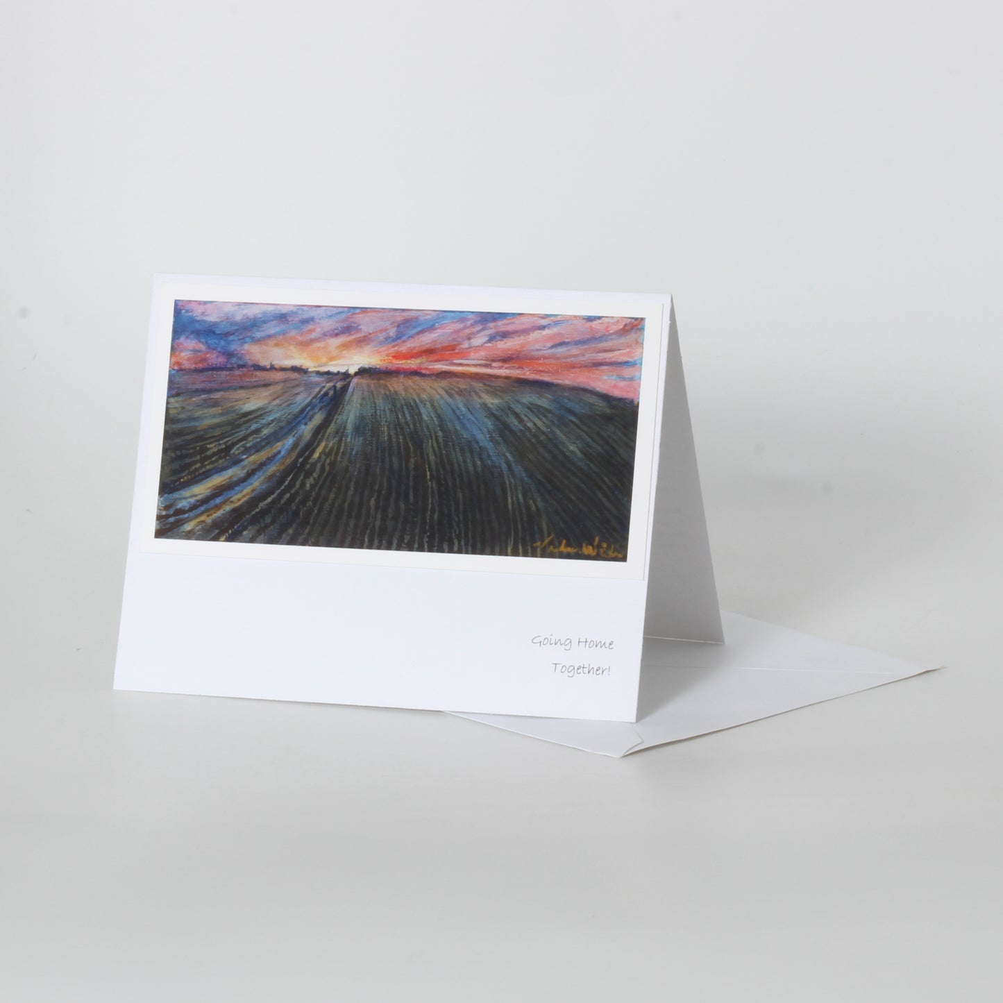greeting card of field and sunset
