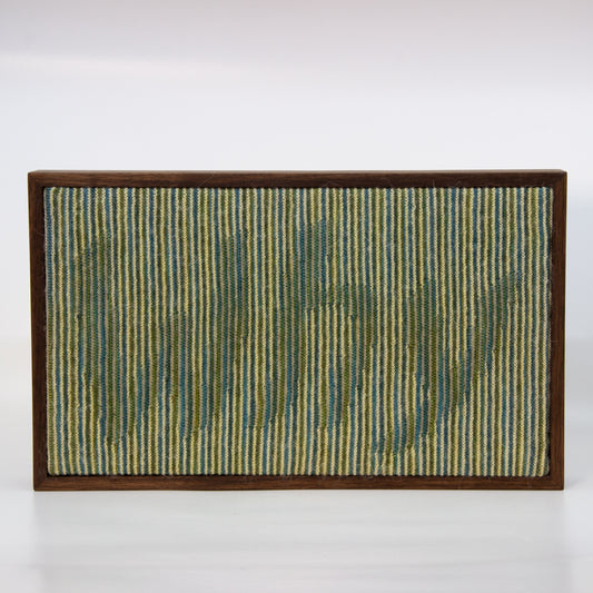 Binary knitted wall hanging with cream blue and green yarn. Text: Why