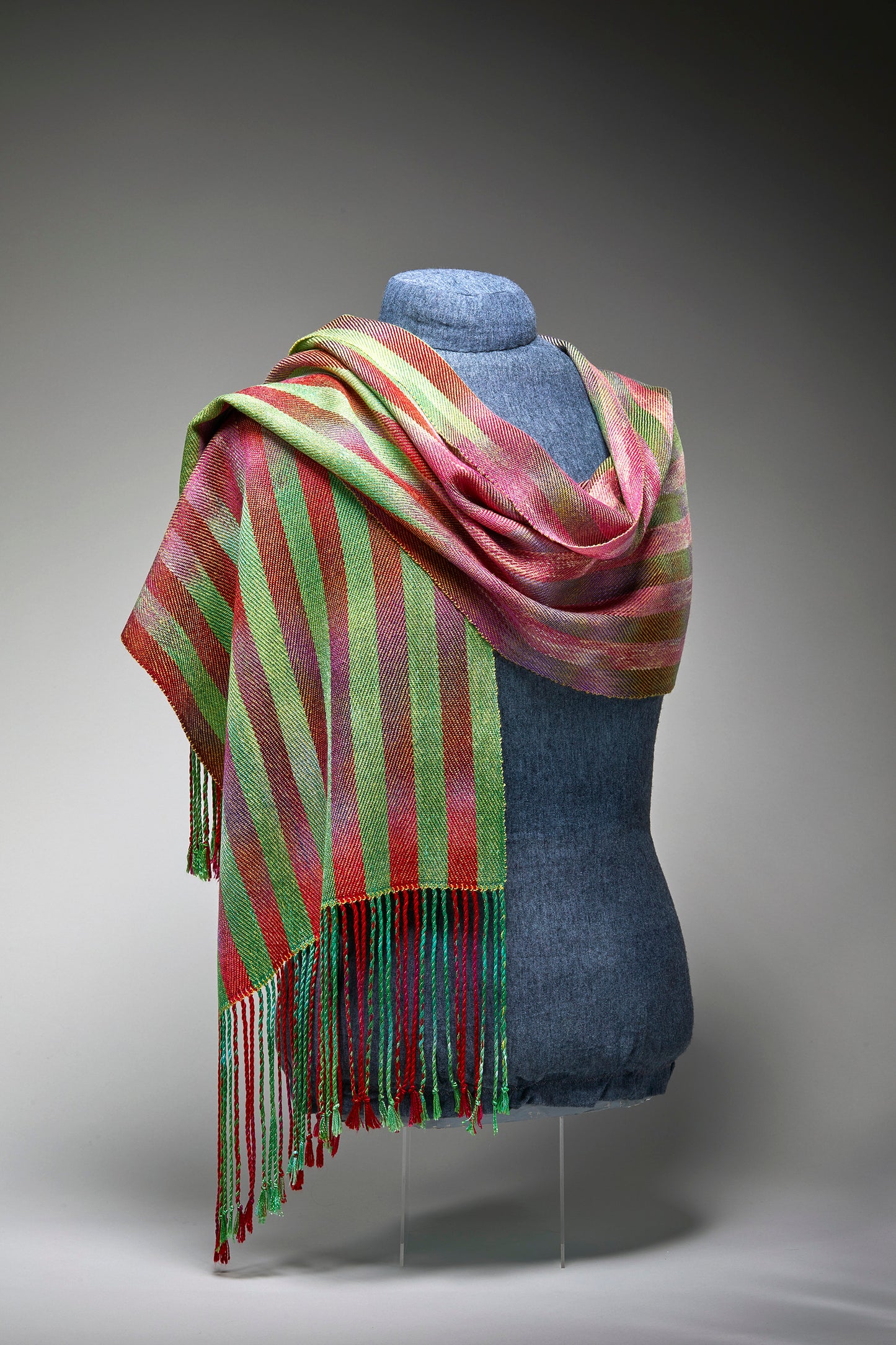 Red and green handwoven fringed scarf