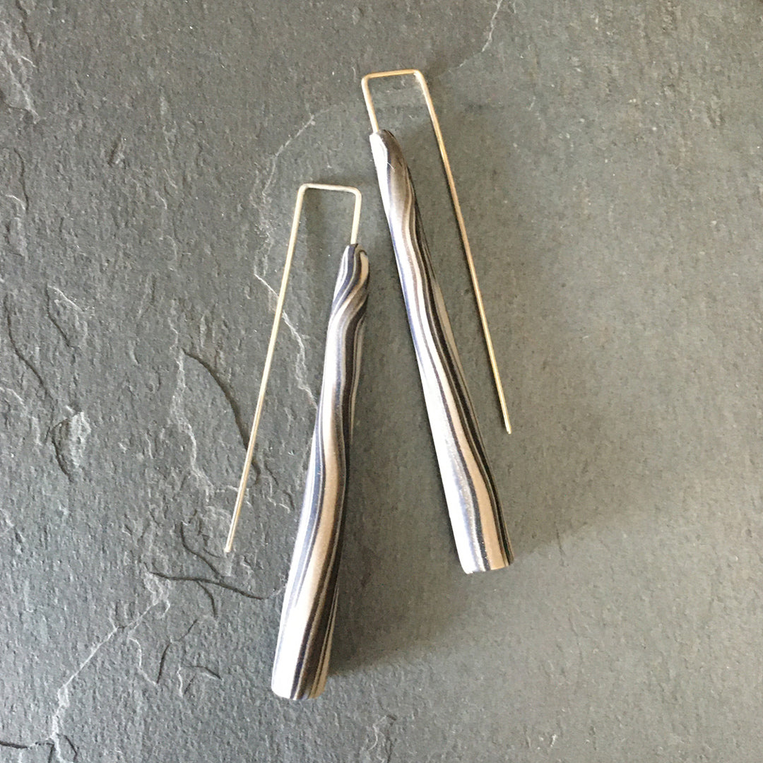 White and black polymer clay earring