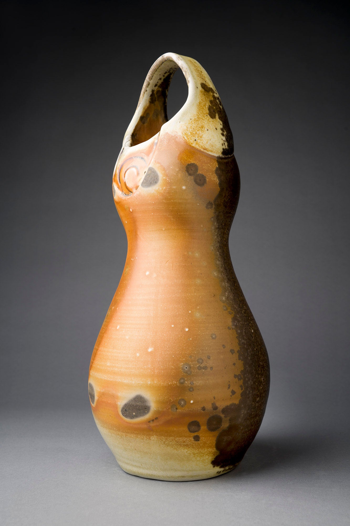 Brown clay vase with handle