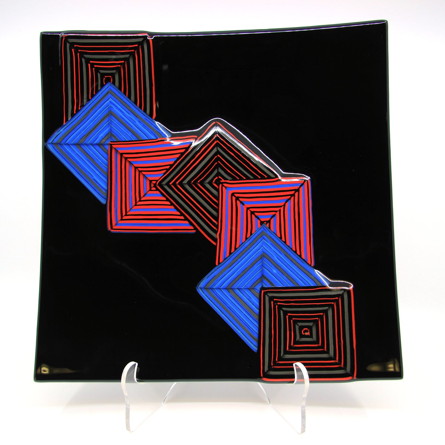Black glass plate with blue and red squares