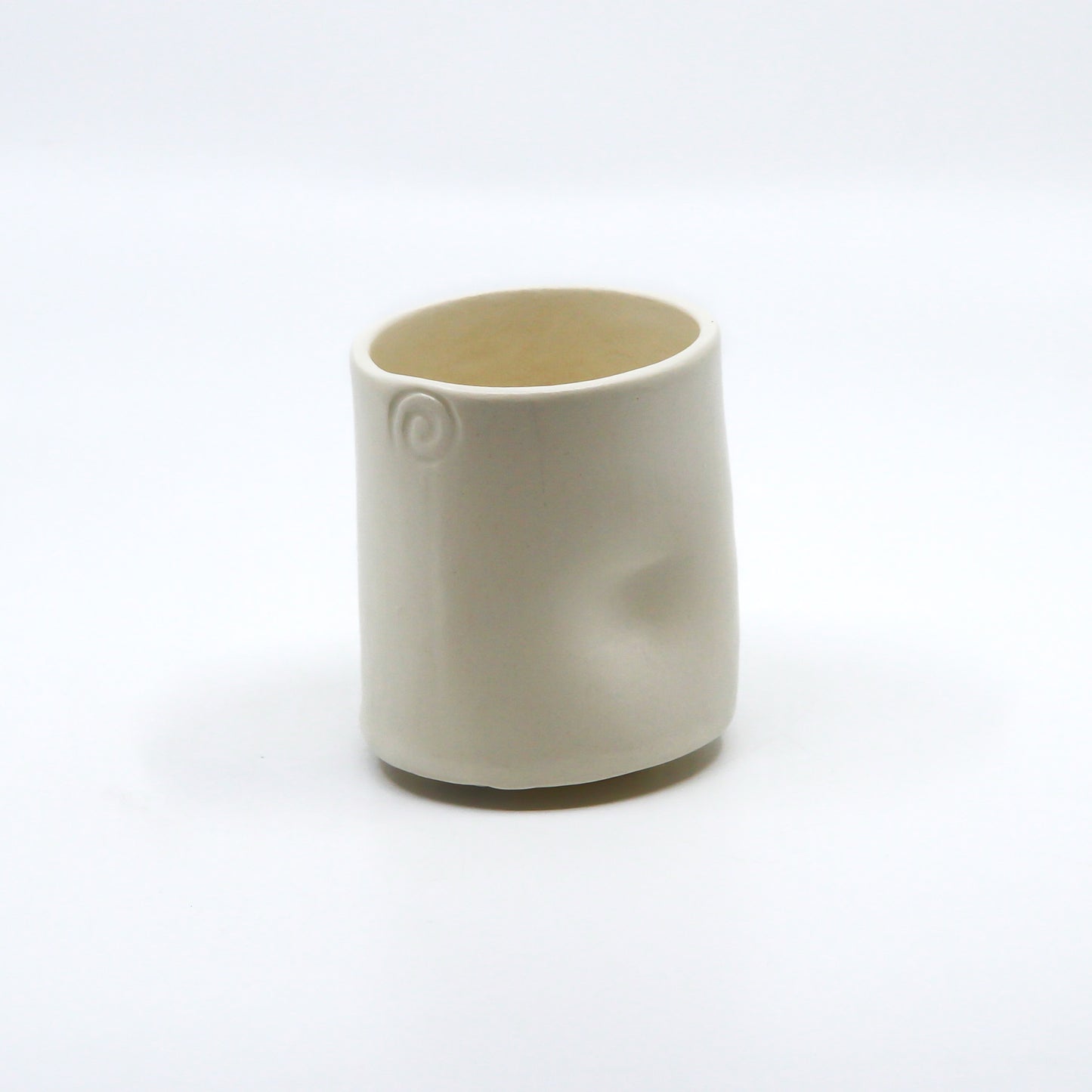 Back of cup with thumb print