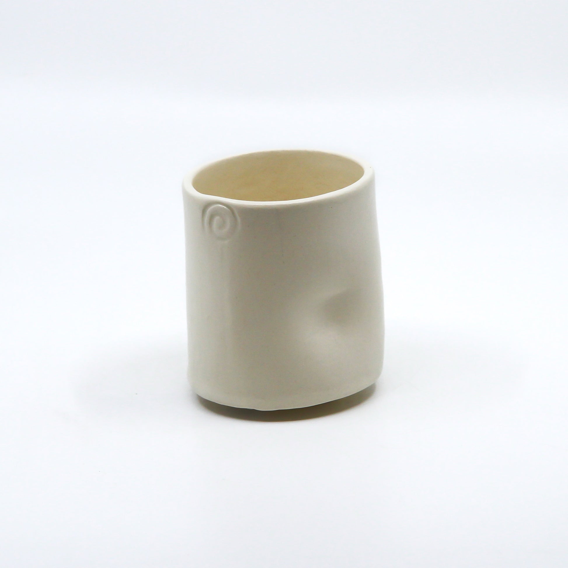 Back of cup with thumb print