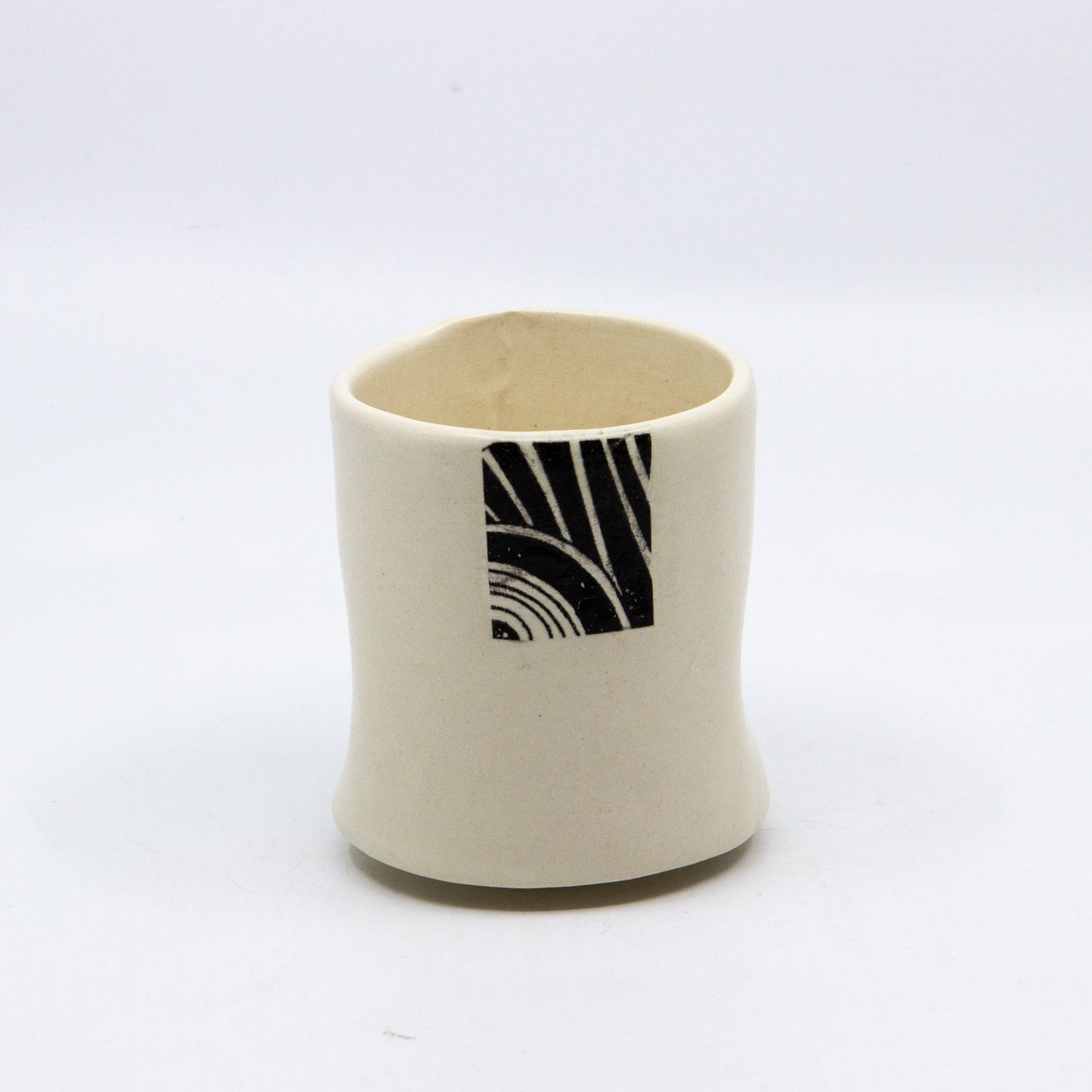 White tea cup with square pattern