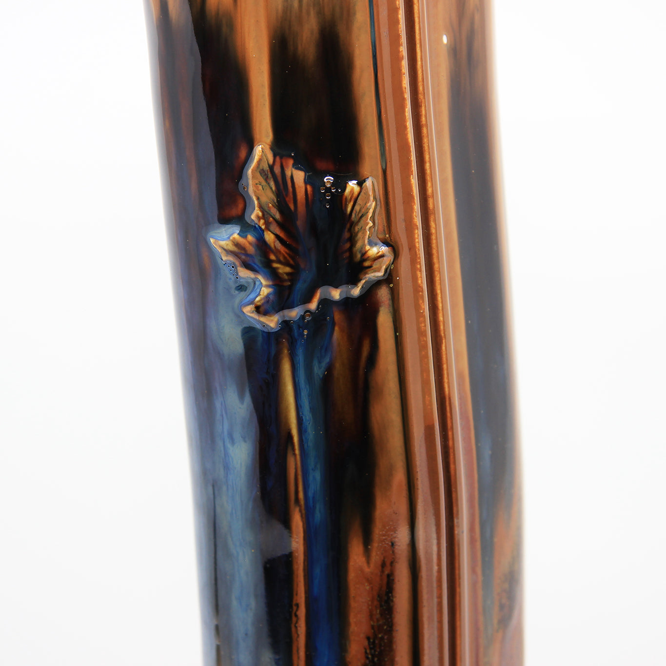 Close up detail of maple leaf vase