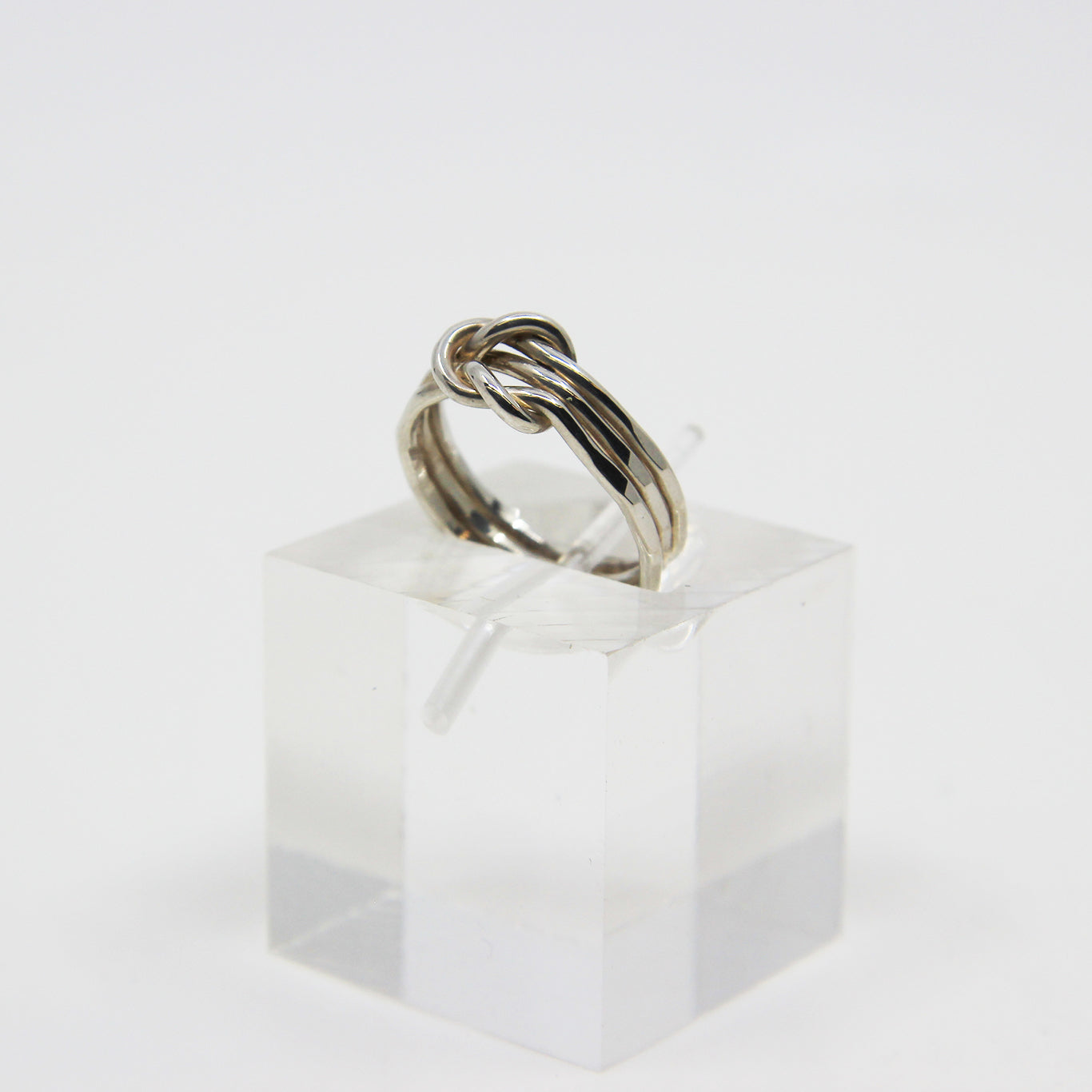Silver ring knotted in middle