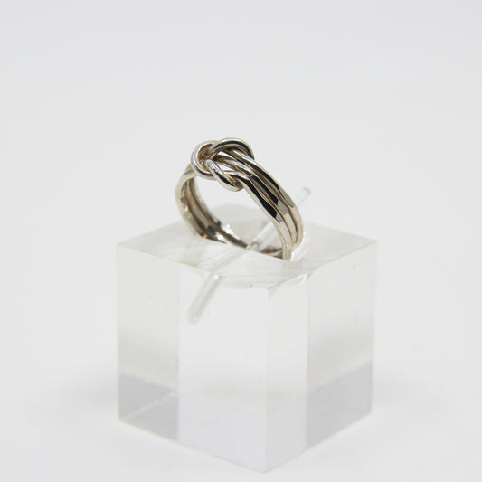 Silver ring knotted in middle