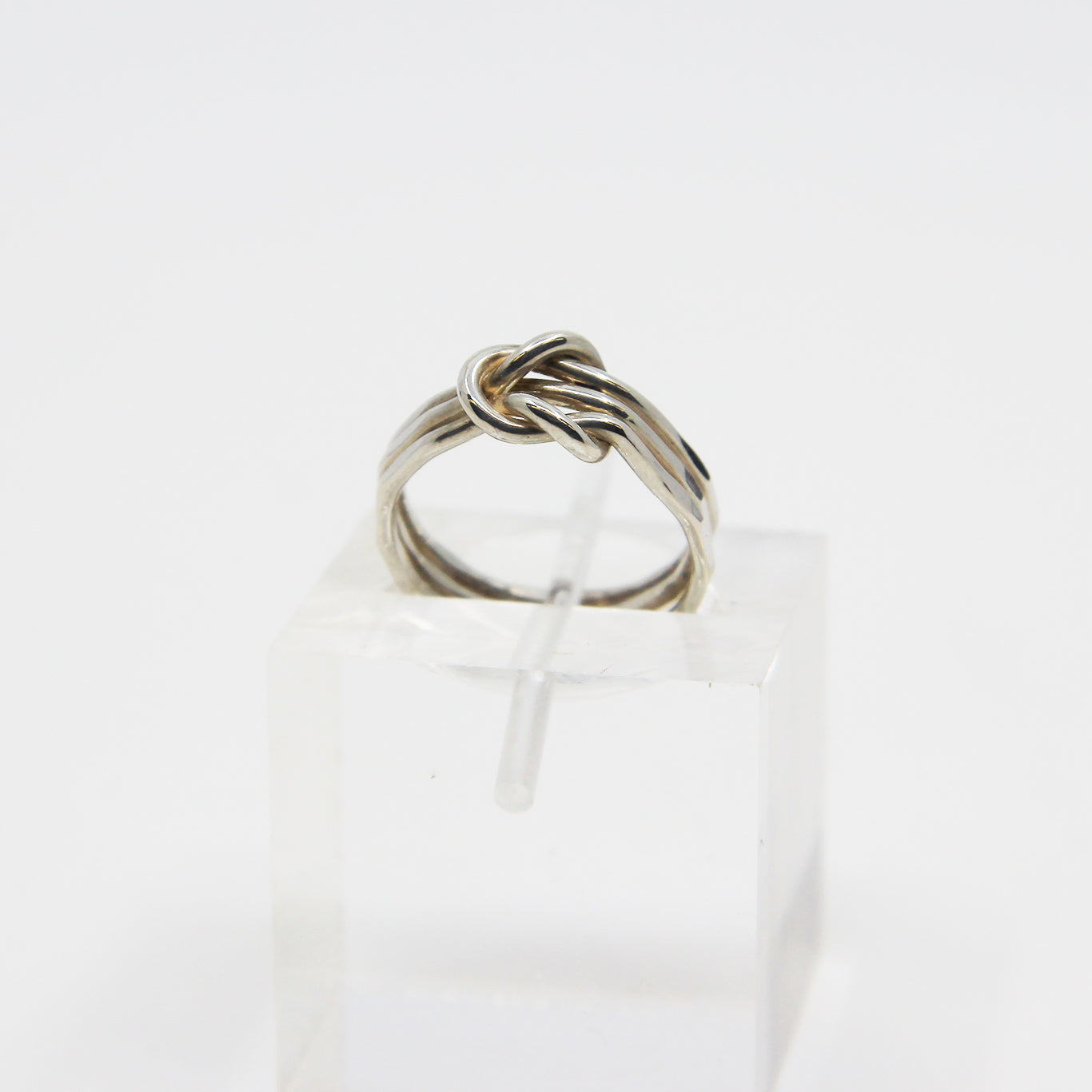 Silver ring knotted in middle