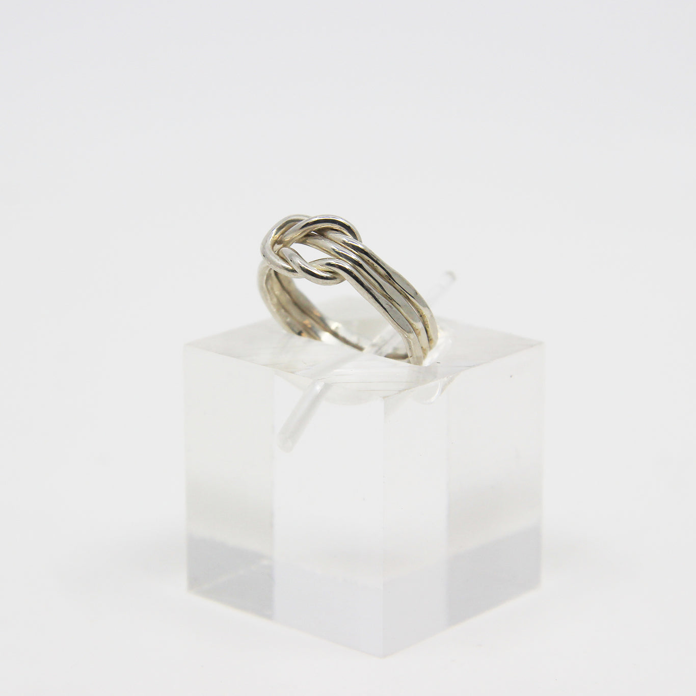 Silver ring knotted in middle