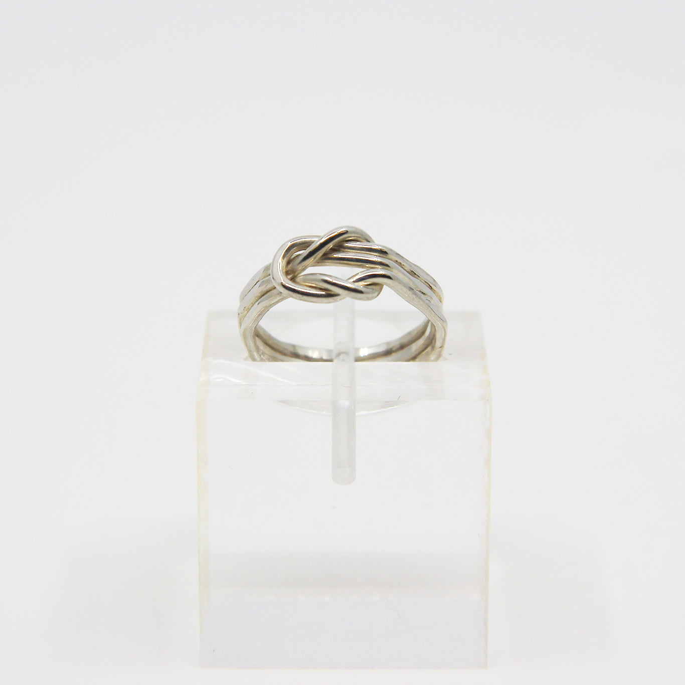Silver ring knotted in middle