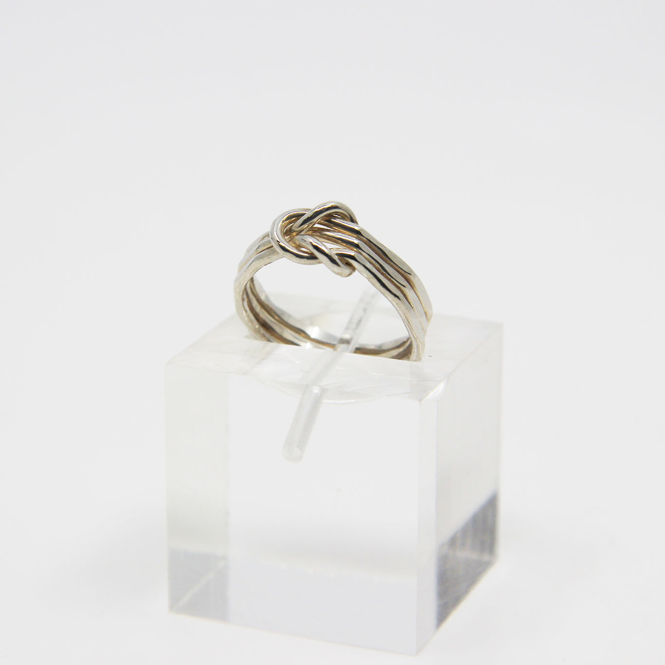 Silver ring knotted in middle