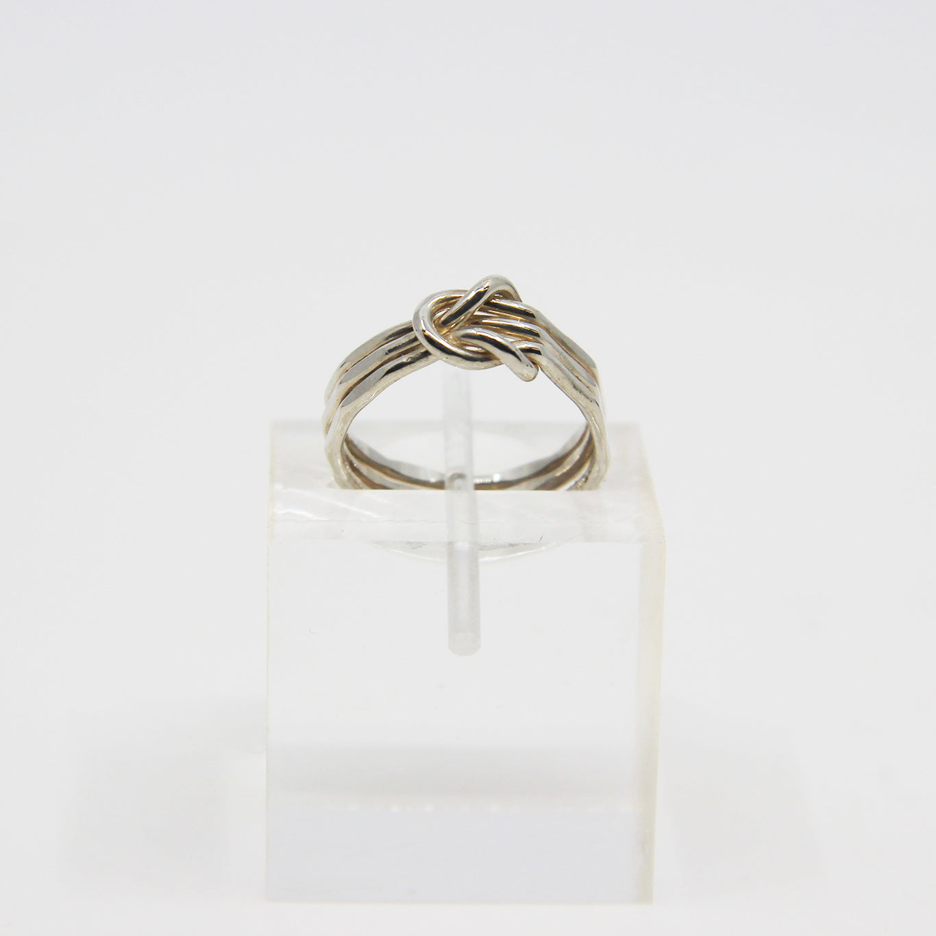 Silver ring knotted in middle
