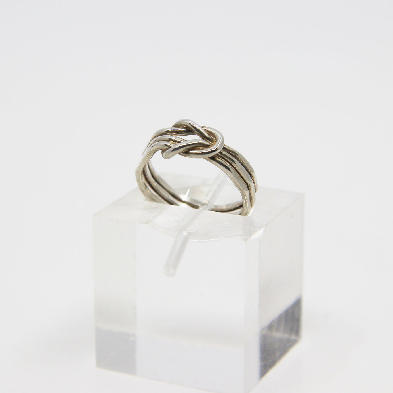 Silver ring knotted in middle