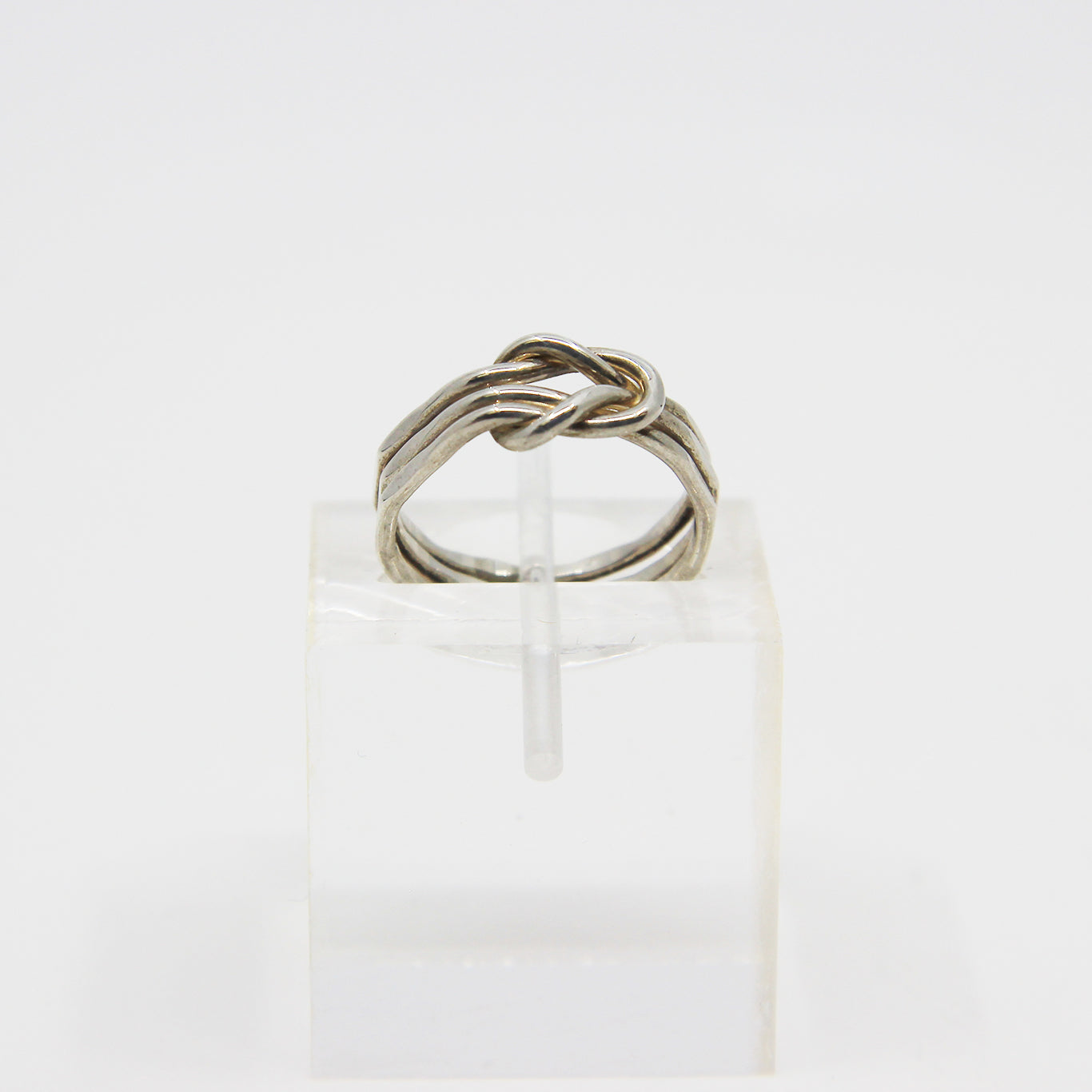 Silver ring knotted in middle