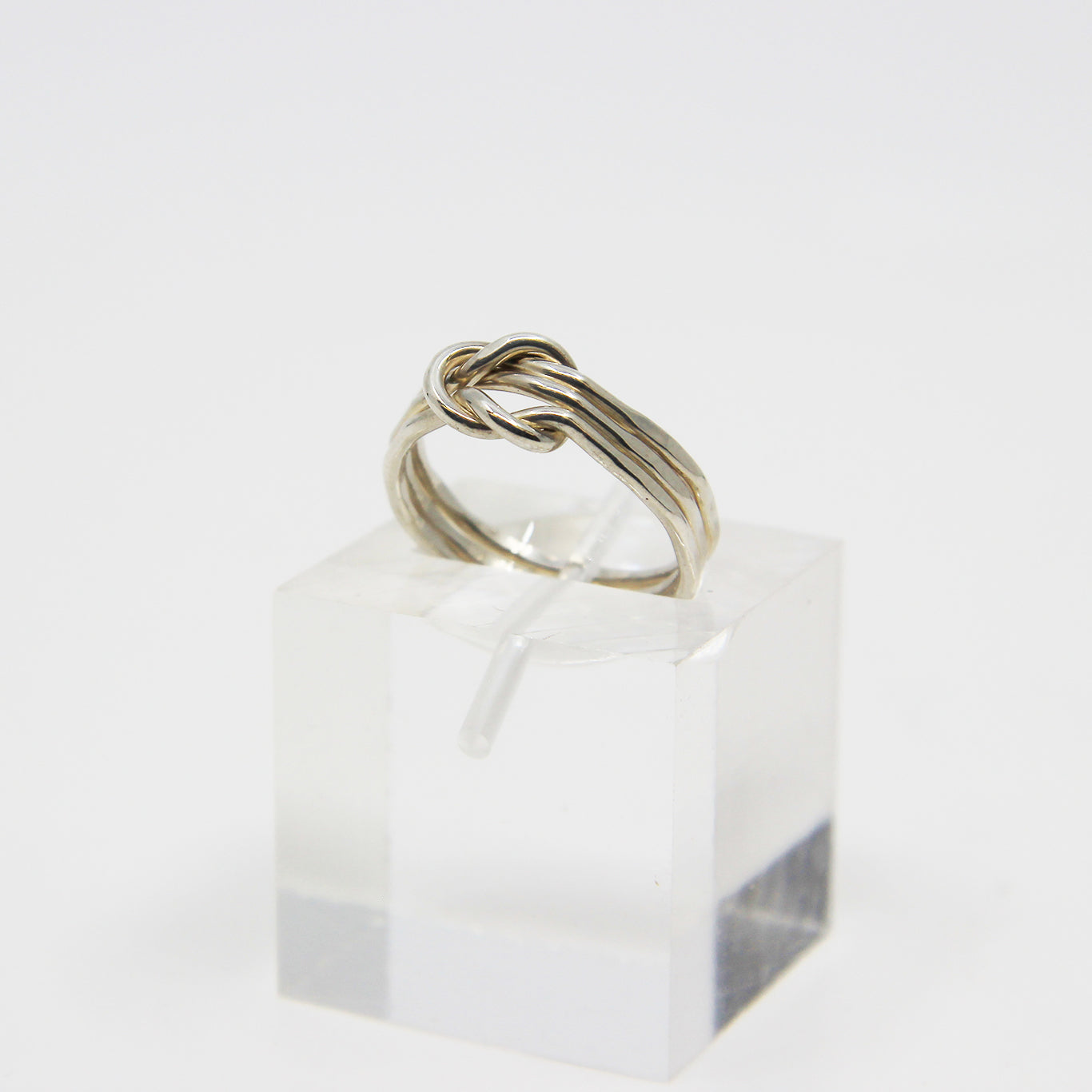 Silver ring knotted in middle