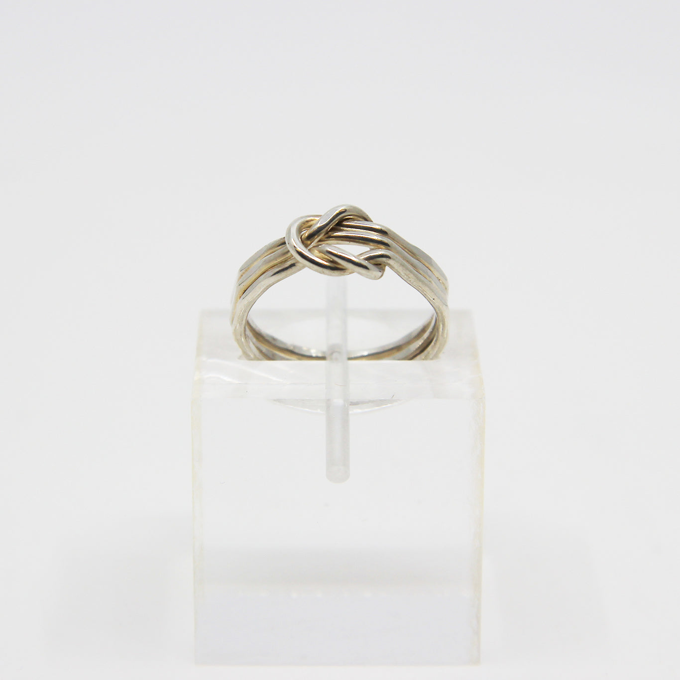 Silver ring knotted in middle