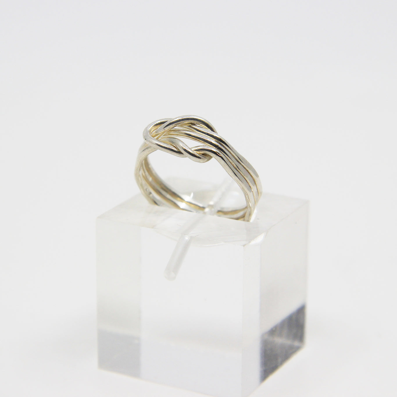 Silver ring knotted in middle