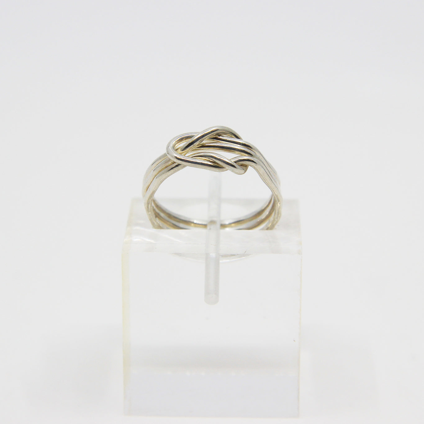 Silver ring knotted in middle