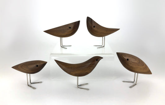 Five dark brown birds in different abstract shapes with metal feet