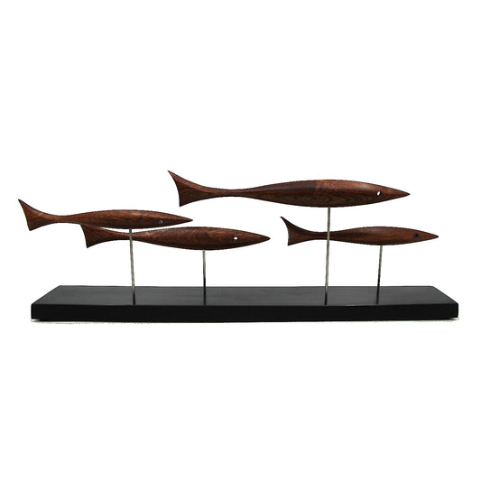 Four brown fish on a black stand