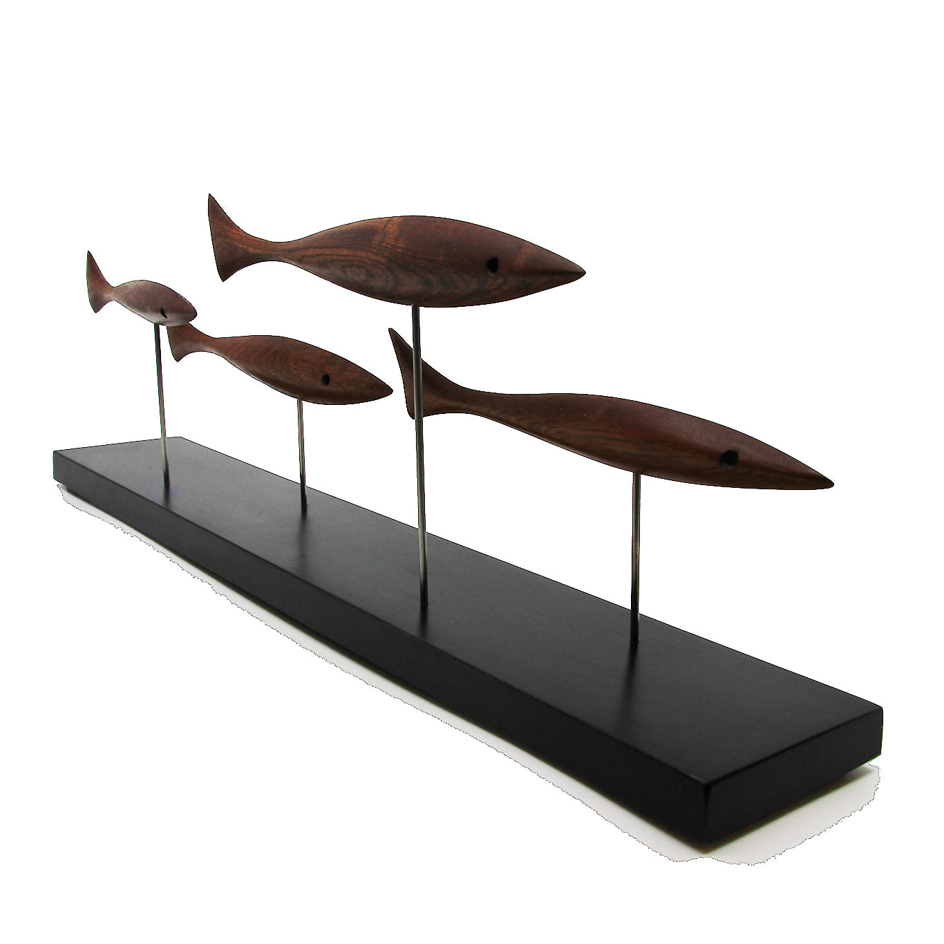 Four brown fish on a black stand