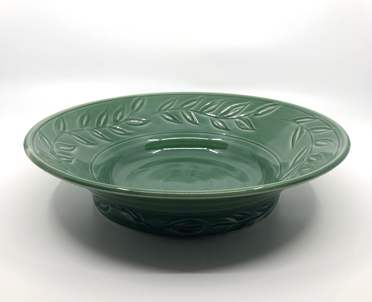 Green bowl with carved vine pattern