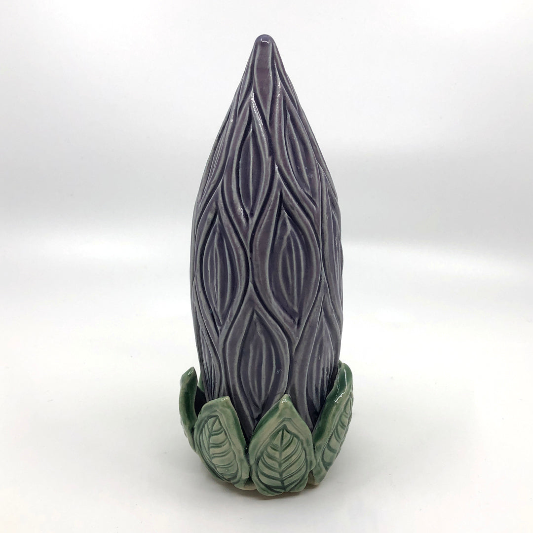 Purple carved clay stake shaped as a flower