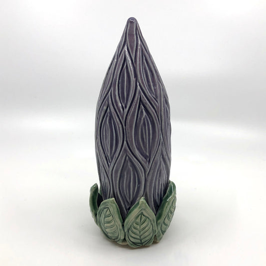 Purple carved clay stake shaped as a flower
