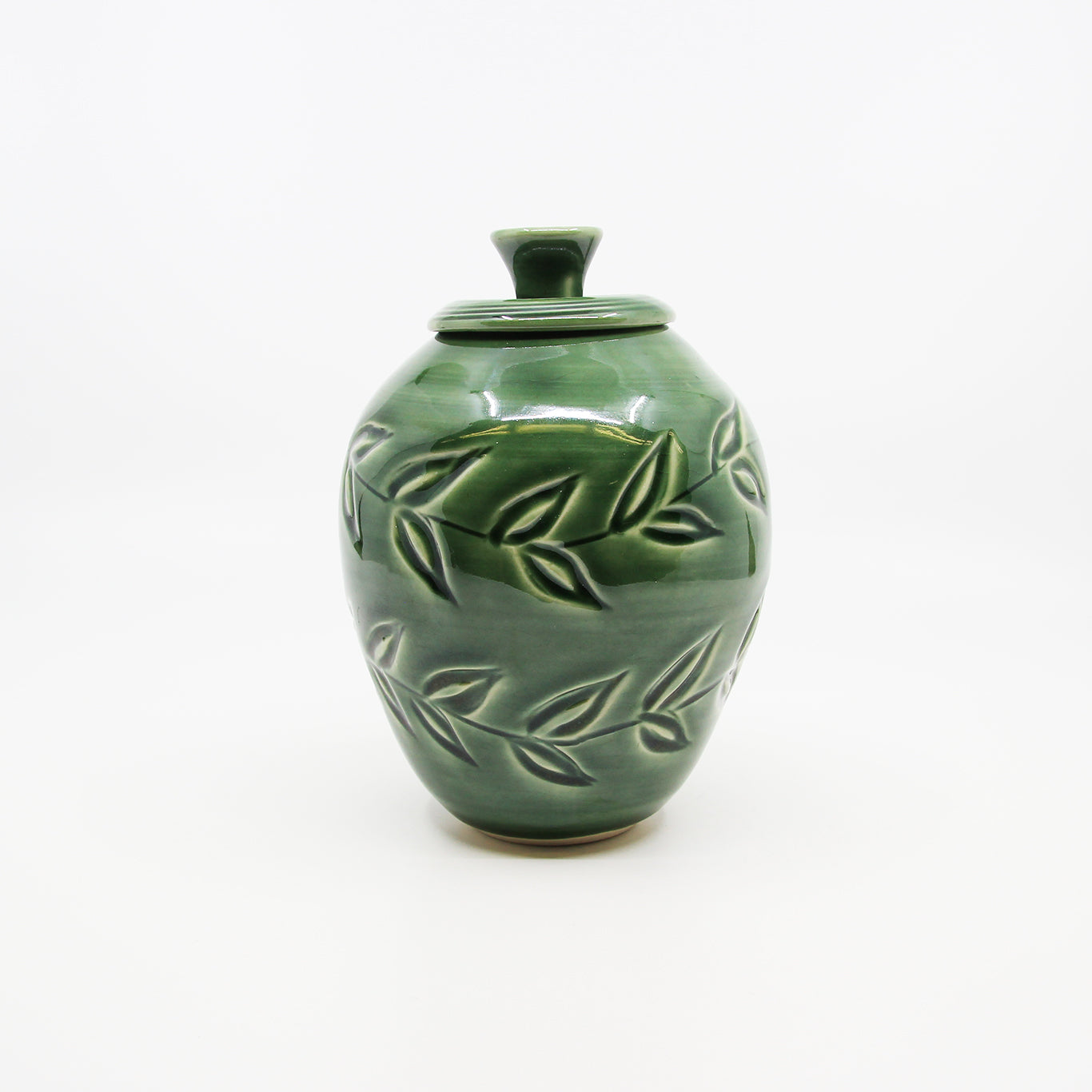 Green jar with carved leaves