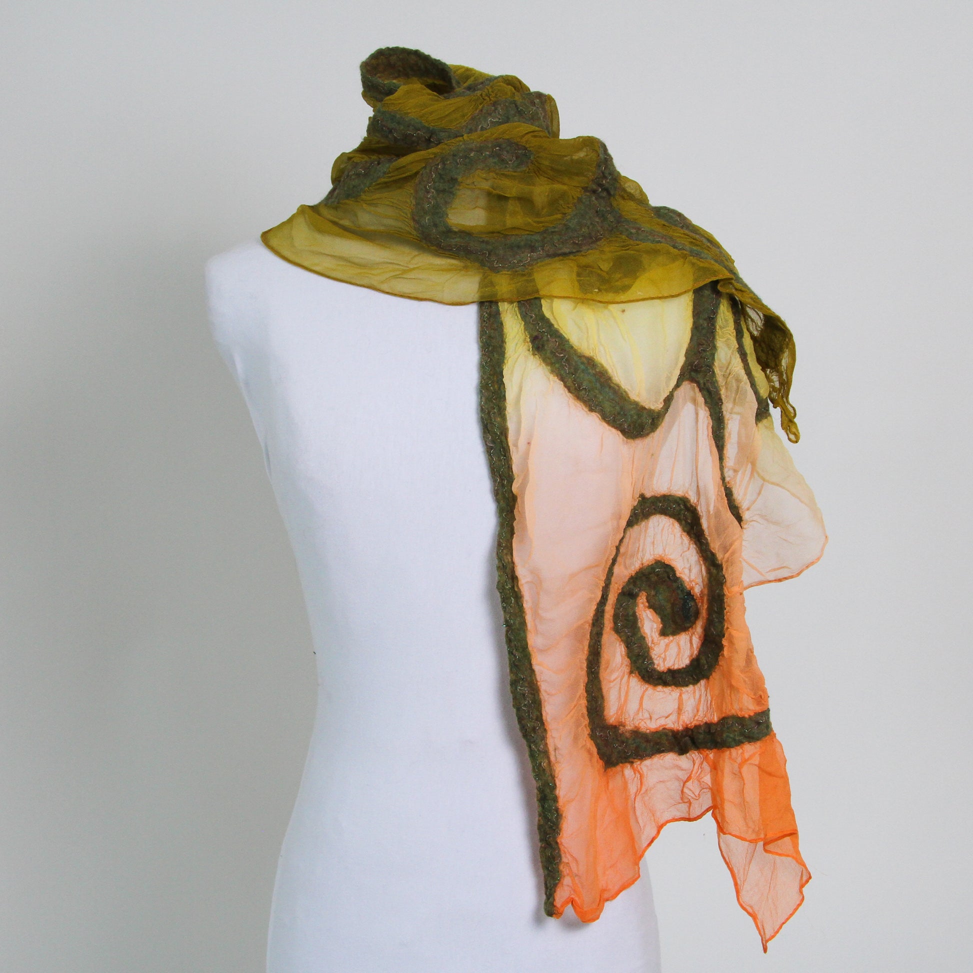 Green and orange gradient scarf with wool swirl detail