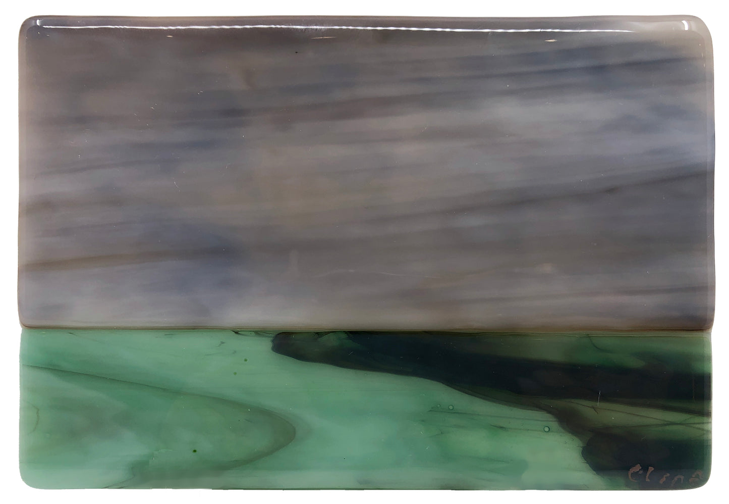 Grey sky against green ground