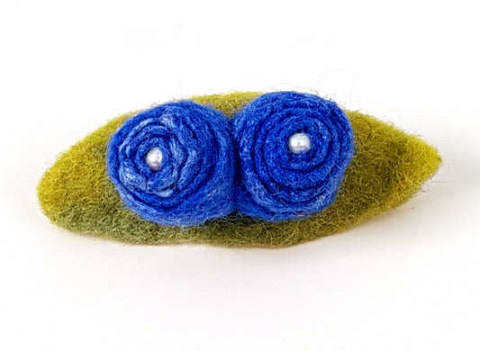 Two blue flowers with leaves