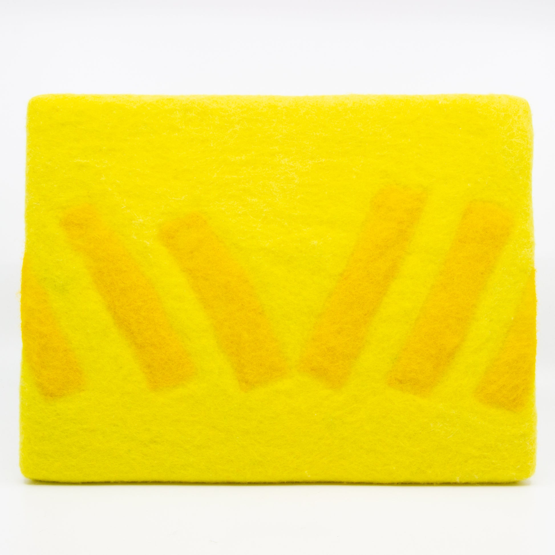 Yellow felted wall hanging with abstract shapes