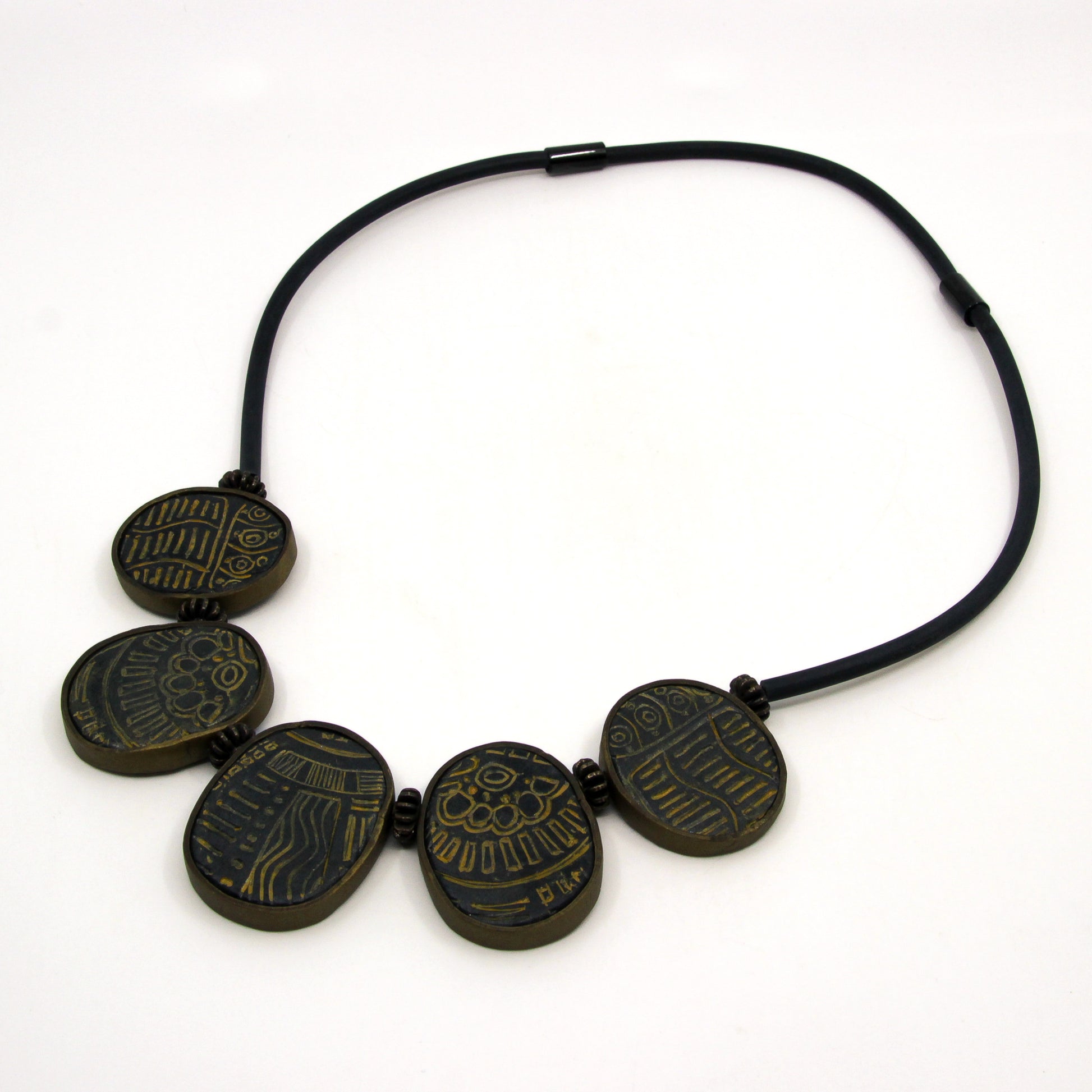 Patterned tokens on a leather strap