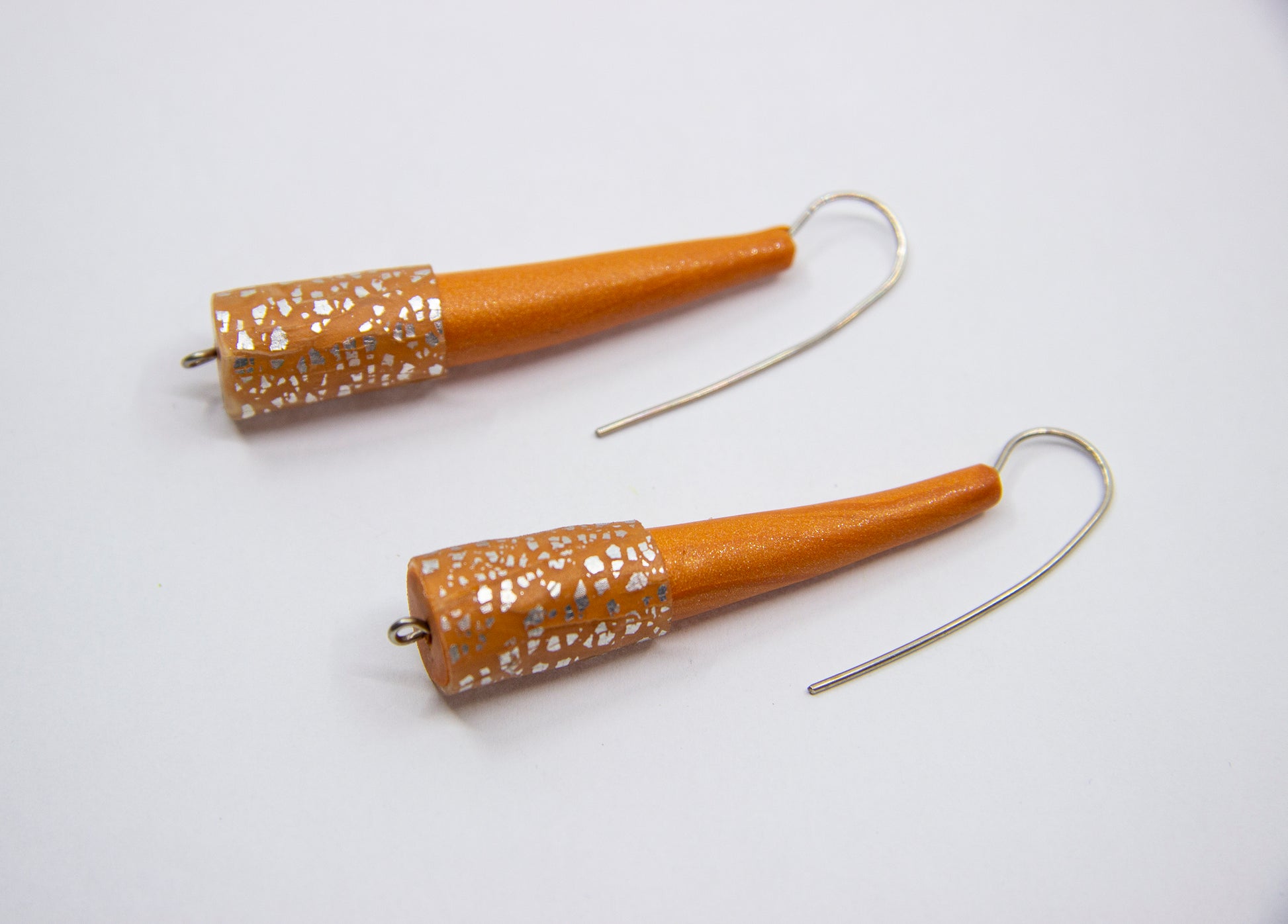 Orange cone earrings with silver specks