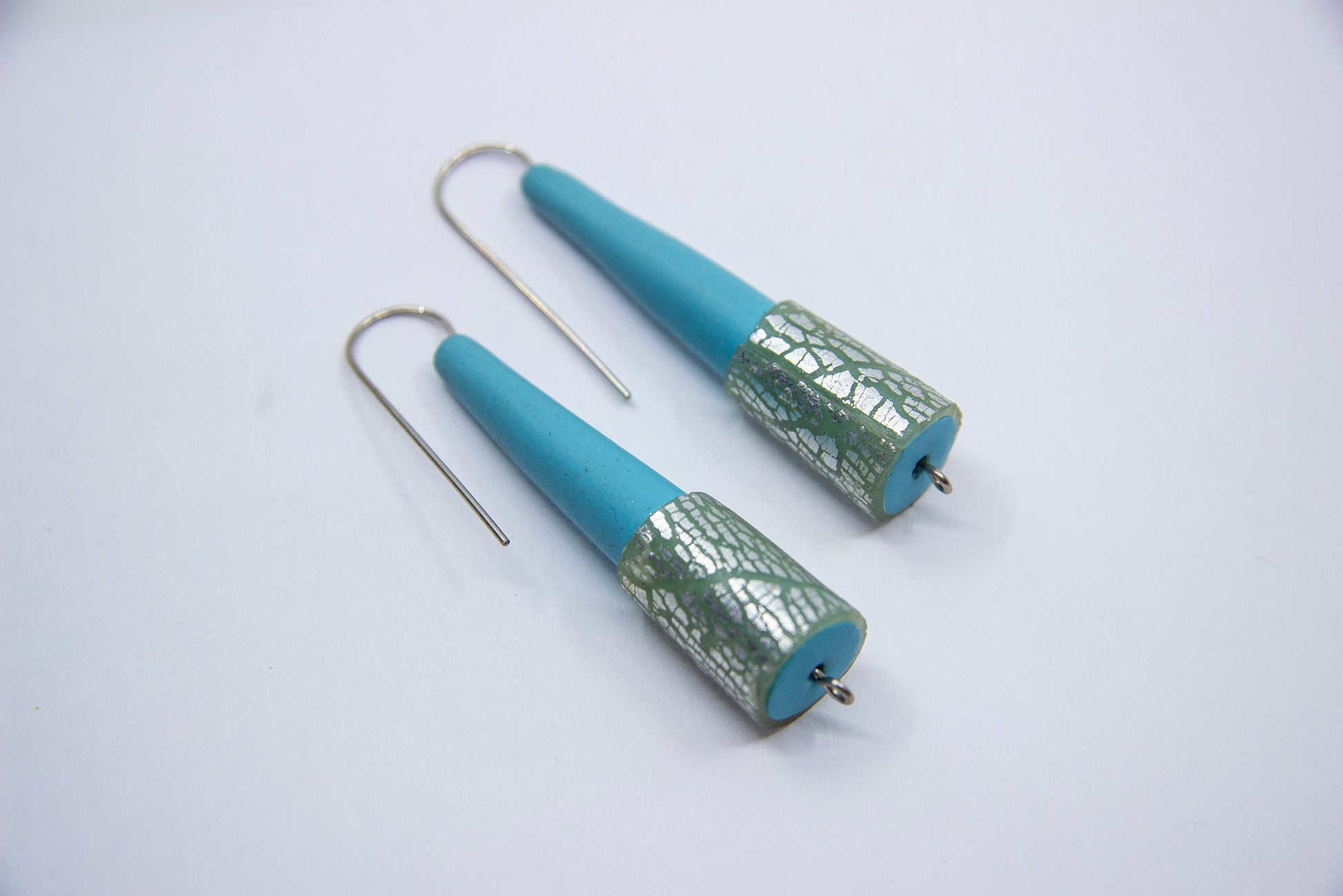 Blue cone earrings with silver specks