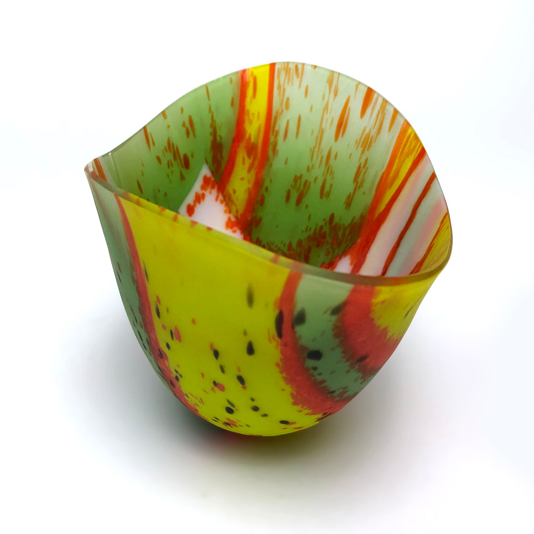 Green, orange, and yellow glass vessle