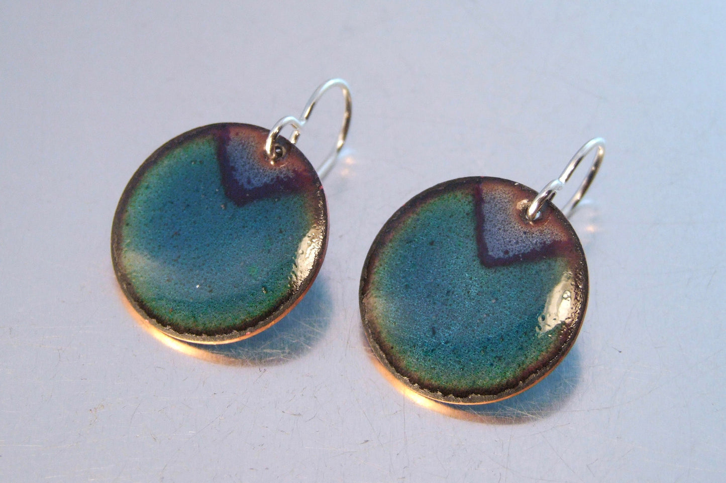 Round blue and green earrings